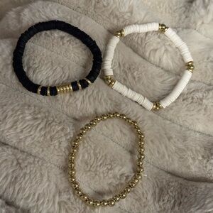 Set of Three Beaded Bracelets in Black, White, and Gold